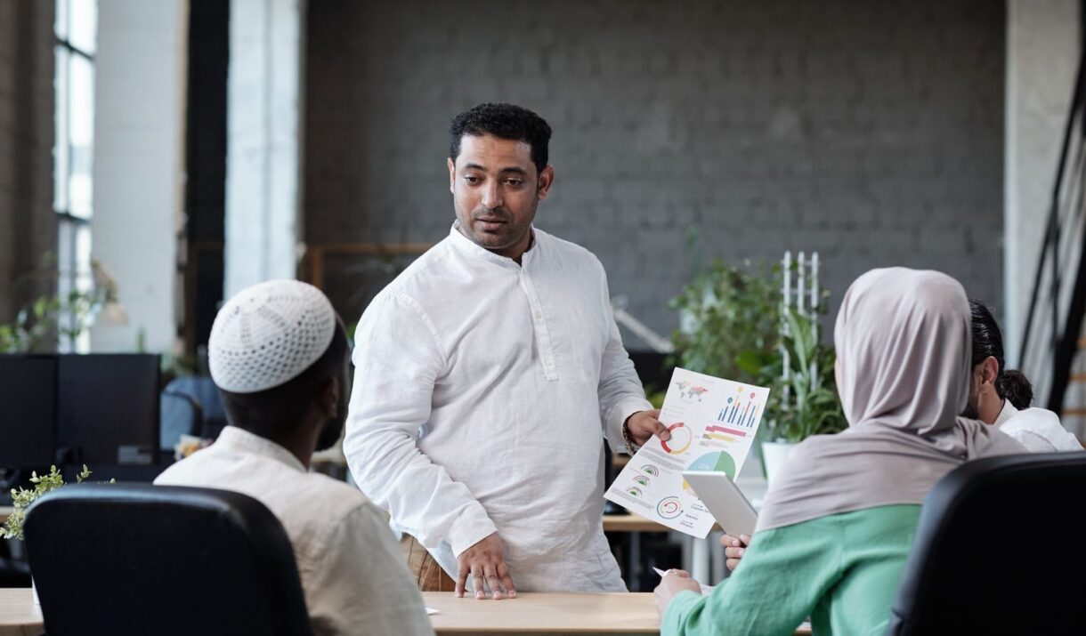 Confident Businessman With Financial Paper Looking ZWVQ27J 2 1220x715