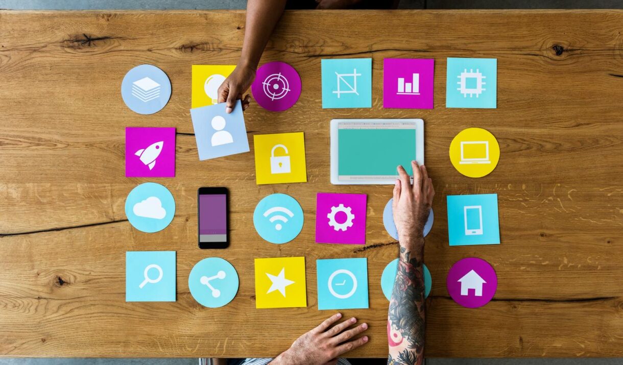 Group Of Computer Icon On The Wooden Table P77YUSB 2 1220x715